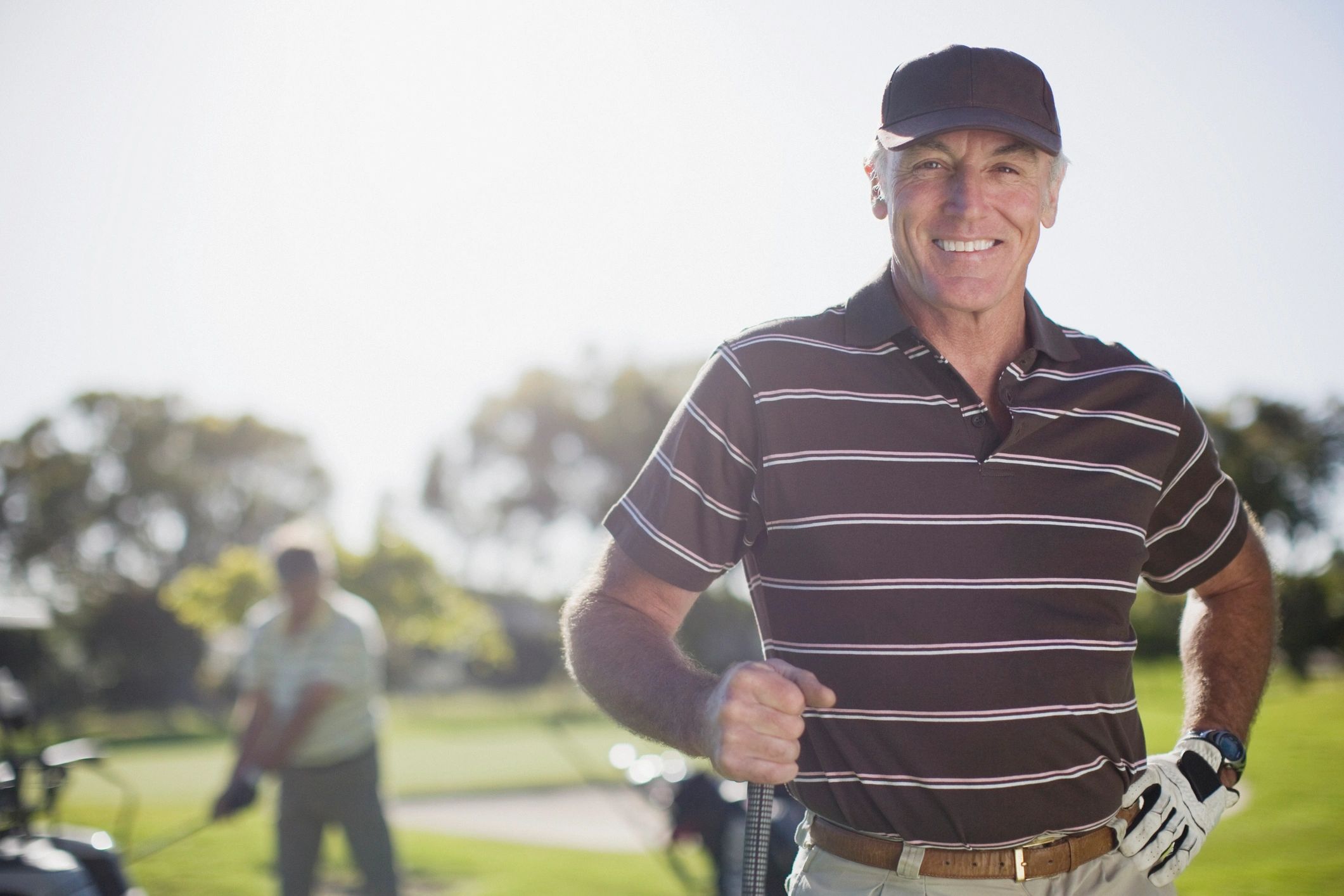 veteran golfer practicing